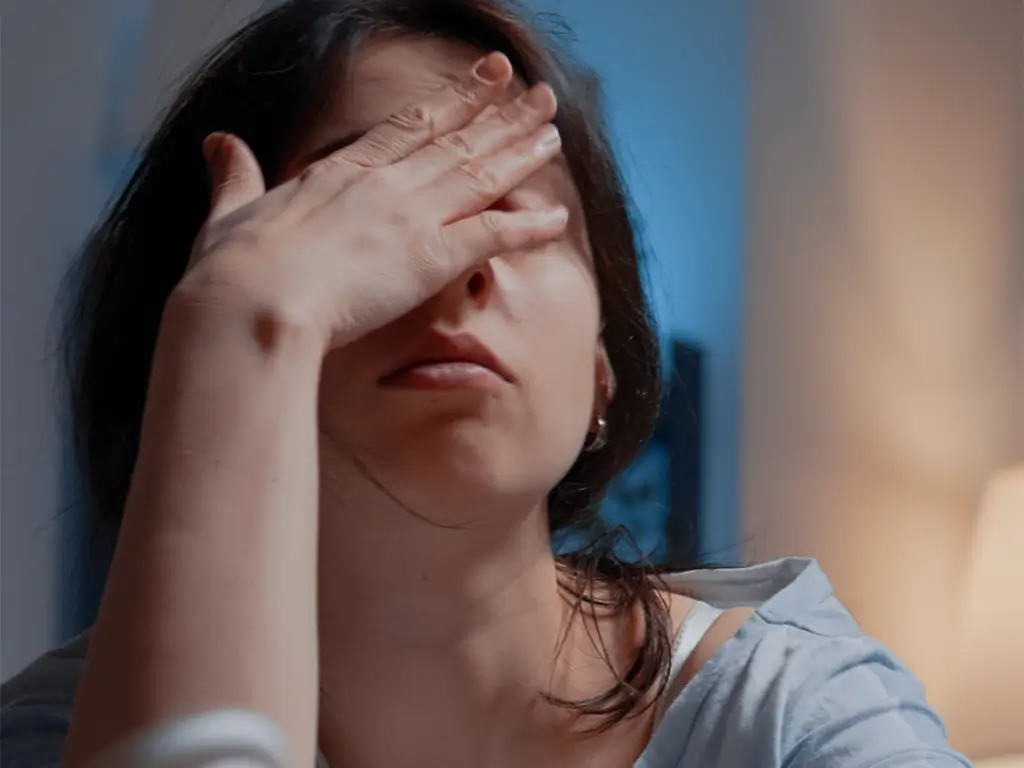 Caregiver experiencing emotional stress while supporting someone with cancer